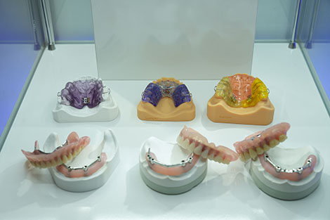 Orthodontic and denture samples in a display case