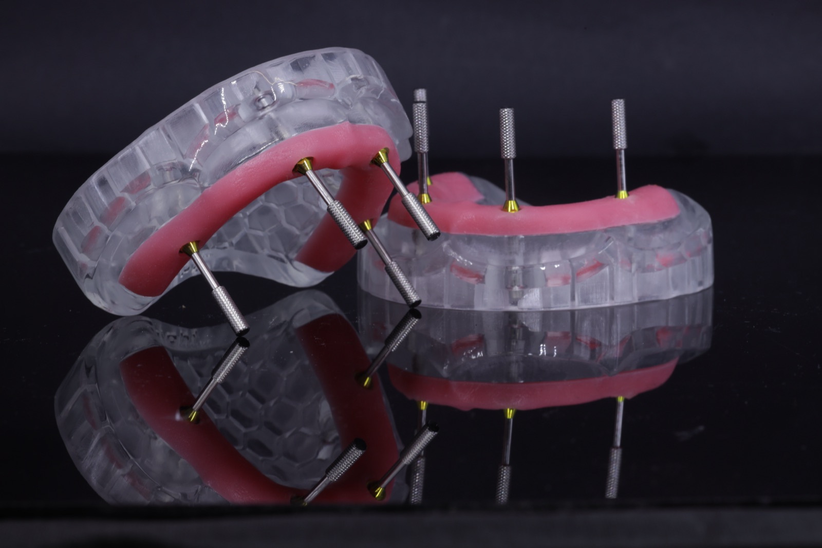 Angulated multi-unit abutments on clear implant model